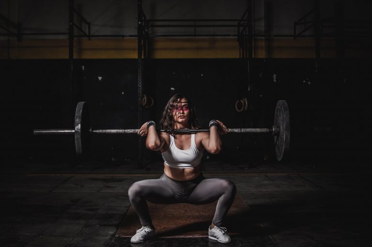 girl lifting heavy weight